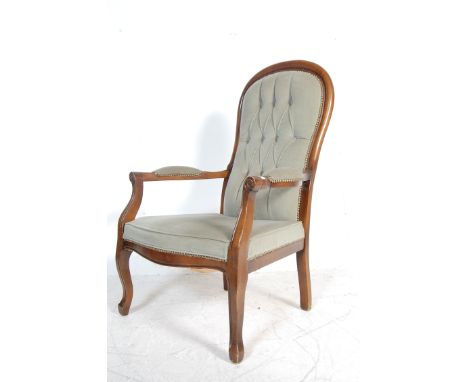 An antique style Victorian Revival mahogany armchair / lounge chair / easy chair having a chesterfield style button backrest,