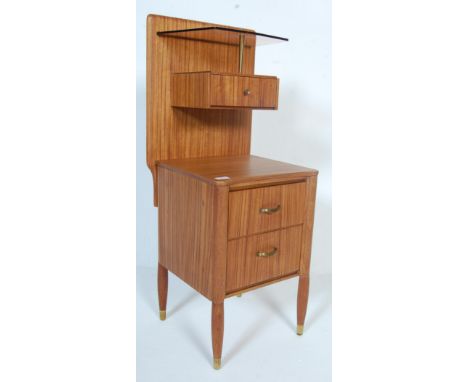 A vintage retro Uniflex teak wood night stand having a back panel to the top mounted with a smoked glass shelf and stand alon