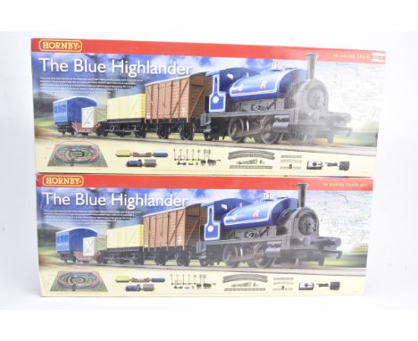 A pair of Hornby 00 Gauge R1101 The Blue Highlander Trains Set, comprising CR blue Saddle tank engine, three wagons, 4-wheel 