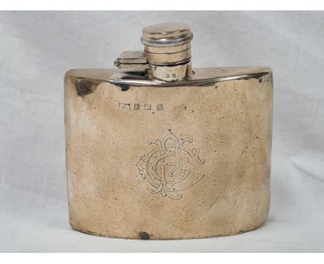 A SILVER HIP FLASK OF CURVED OUTLINE