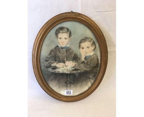 AN OVAL 19THC PASTEL DRAWING. A PORTRAIT OF TWO YOUNG BOYS STOOD BY A SMALL ROUND TABLE,  OVAL,  7'' X 9''.  IN ANTIQUE GILT 