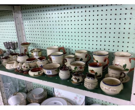 SHELF OF APPROX 26 PIECES OF TORQUAY MOTTO WARE POTTERY, A COUPLE CHIPPED