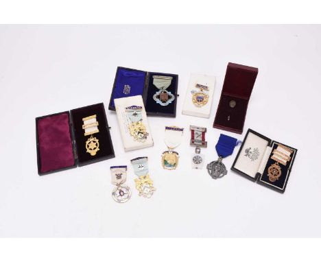 A collection of Masonic regalia comprising an apron, sash, Masonic jewel, pair of gloves etc together with medals comprising 