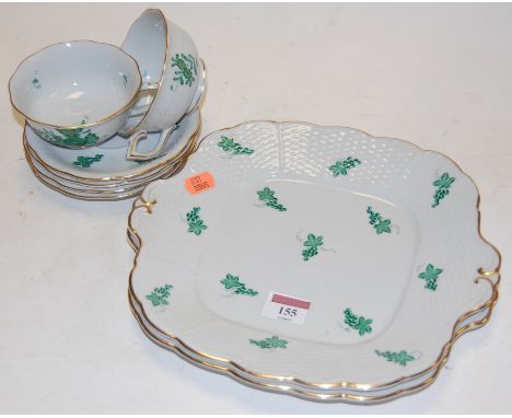 An early 20th century Herend porcelain eight place setting part tea service, each painted with green leaf decoration and heig