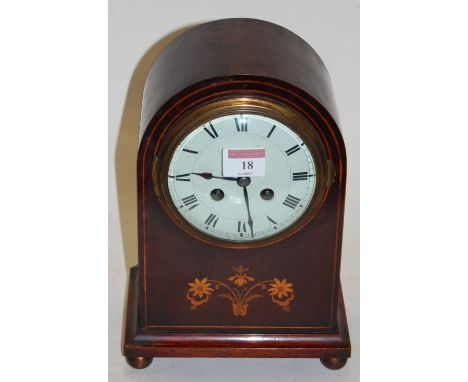 An Edwardian mahogany and satinwood inlaid cased mantel clock, having enamelled dial with Roman numerals and eight day moveme