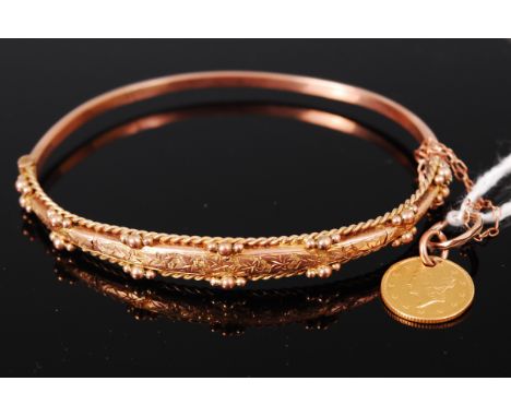A 9ct gold hinged bangle, having 1851 one dollar gold pendant, gross weight 7.3g