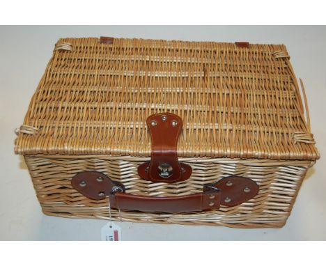 A modern wicker two place setting picnic hamper