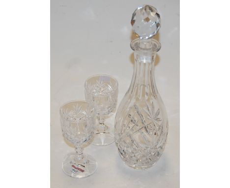 A cut glass decanter and stopper; together with a matching set of six glasses