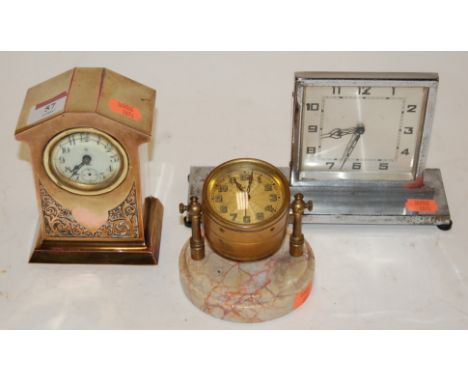An Art Deco chrome cased mantel clock, having silvered dial with Arabic numerals; together with two other mantel clocks (3)