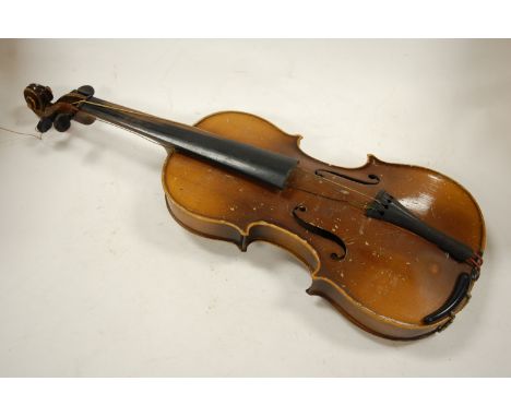 Am early 20th century Continental violin, bearing label for Antonio Stradivarius, with two bows, in fitted case