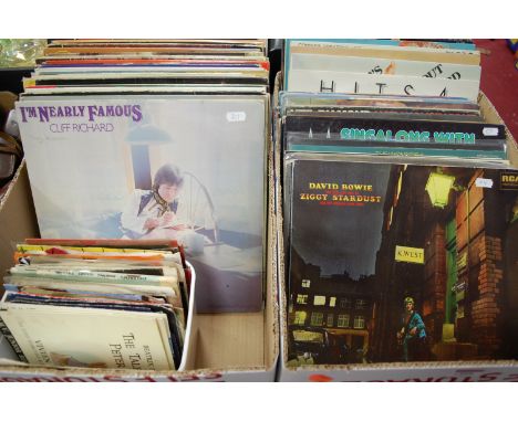 Two boxes of assorted long playing and single records to include David Bowie and the Rise and Fall of Ziggy Stardust, and The