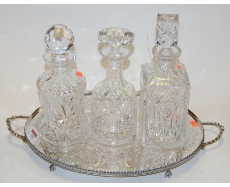 A Waterford cut glass decanter and stopper together with two others on silver plated twin handled tray (4)