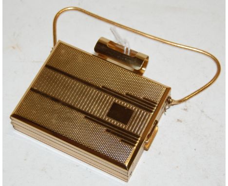 A cased ladies engine turned gilt metal evening bag, with fitted powder compact and cigarette compartments 