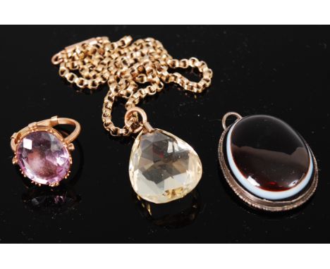 A yellow metal amethyst set dress ring; a large faceted pear shaped citrine pendant on gilt metal belcher link neck chain; an