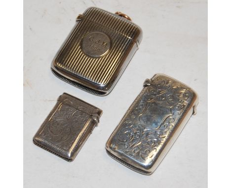 A  silver and engraved pocket vesta case together with engine turned silver vesta case and one other smaller engraved example