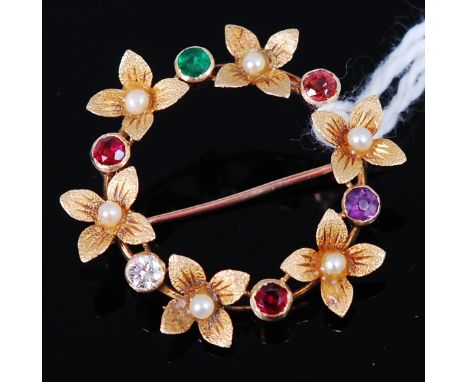 A 9ct gold precious set Regard brooch, the flower head and border set with a ruby, emerald, garnet, amethyst and a single dia