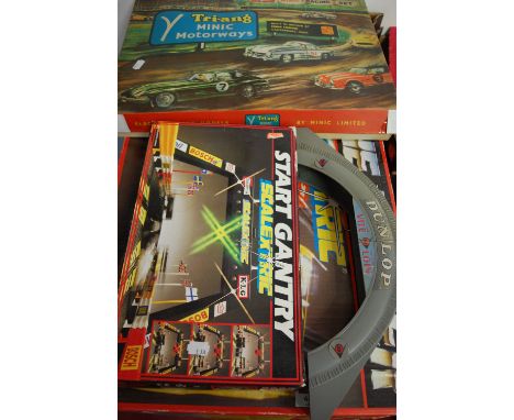 A boxed Triang Minic Motorways electric scale model racing set; together with a boxed Scalextric Porsche Power; and a Scalext