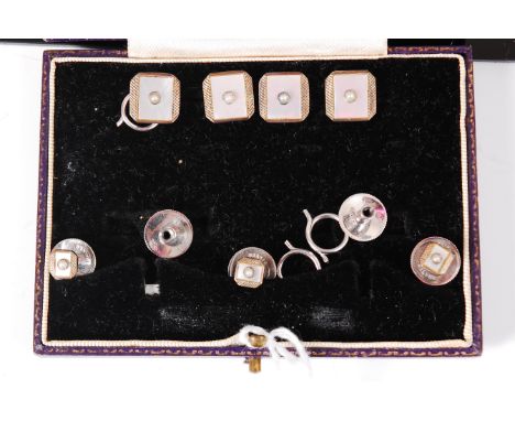 A Harrod's leather cased set of 14ct white gold, silver and mother of pearl set collar studs and dress buttons