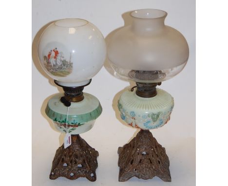 A Victorian oil lamp having opalescent glass shade, painted glass reservoir, and a pierced brass base, together with one othe