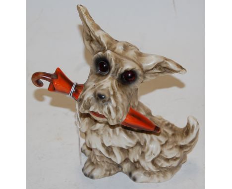 A  Goebel figure of a Scottie-dog with an umbrella in its mouth, h.20cm 