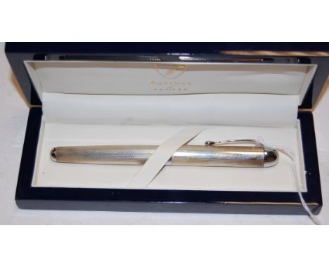 A boxed Aspinall of London engine turned silver fountain pen stamped Aspinall of London to the lid