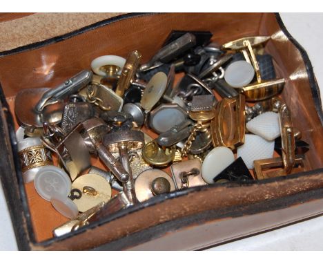 A gilt tooled leather trinket box and contents, mostly of gents cufflinks and buttons
