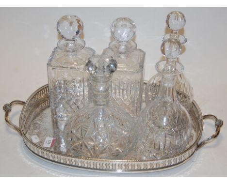 A pair of Edinburgh crystal decanters and stoppers, together with one other pair of glass decanters and stoppers, ships decan