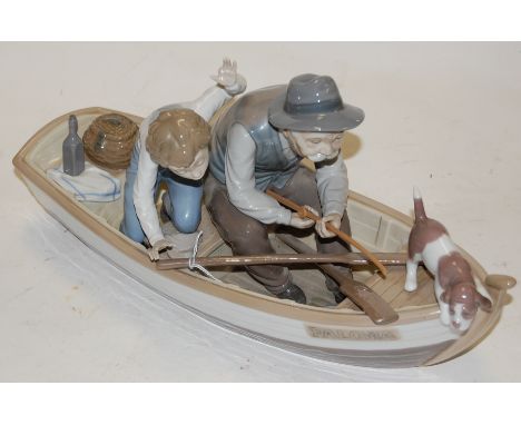 A Lladro porcelain figure group Fishing with Gramps No. 5215, printed mark verso (finger missing from child) width 42cm