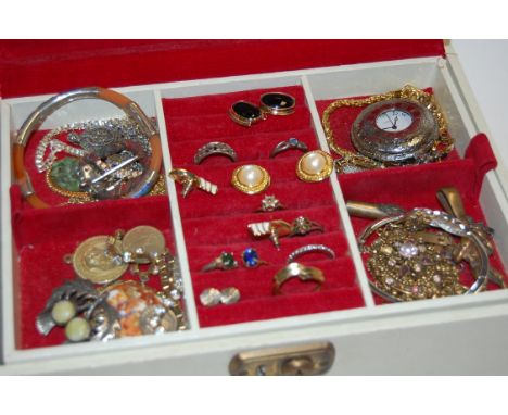 A leather clad jewellery box and contents to include white metal and enamelled bangle, white metal open work ring, modern poc