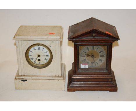 A late 19th century Continental stained pine cased mantel clock, of architectural form, having silvered chapter ring with Rom