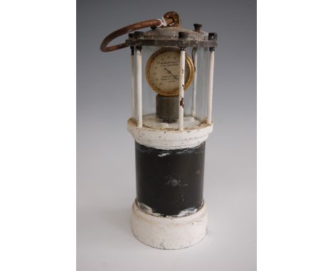 An early 20th century miners gas detection lantern, having later white painted alloy body, the singular dial with outer scale