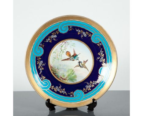 MINTONS GILT ENAMEL PORCELAIN CABINET PLATE
the reserve decorated with hummingbirds, within an unusual swirling border, puce 