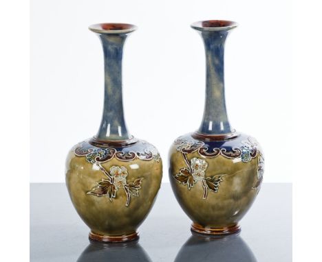 PAIR OF ROYAL DOULTON VASES
of shouldered oviform with high necks, floral c-scroll decoration to body, blue and light green g