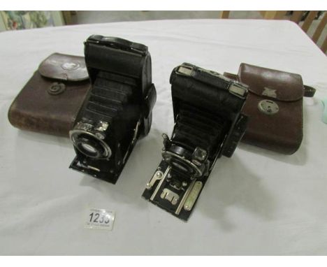 A Vuigllander folding camera in leather case and an N Sign Prontor II folding camera in leather case.