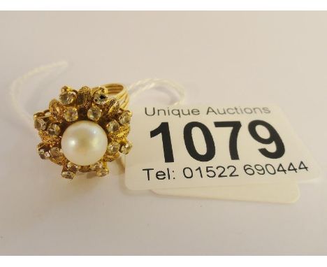 A circa 1970's 14ct gold cluster ring set with centre cultured pearl in a basket setting,