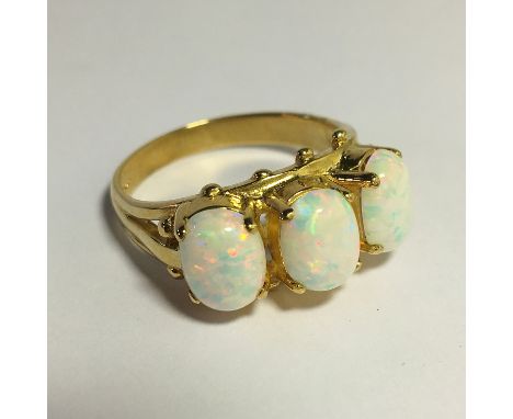 A large 3 stone 9ct gold opal ring, size O.