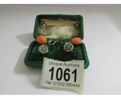 A pair of vintage turquoise set clip earrings and a pair of silver set pendant earrings.