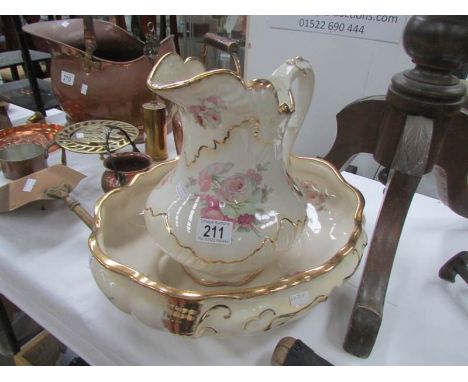 A floral decorated jug and basin set.