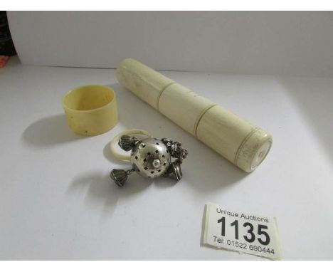 A 19th century silver rattle, a napkin ring and a shaving box.