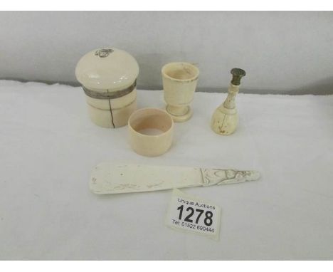 A mixed lot of 19th century bone and ivory items including trinket pot, napkin ring, seal etc.