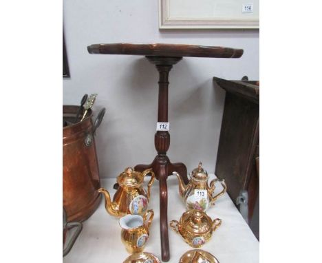 A tripod wine table.