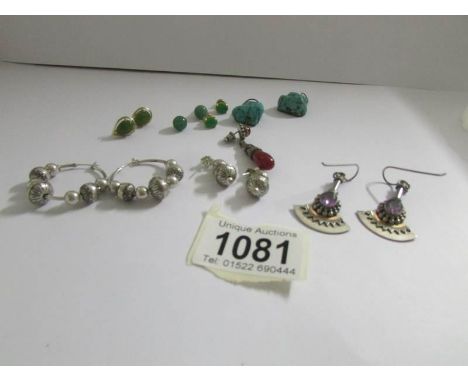 A pair of vintage turquoise ear pendants, two pairs of silver earrings (one hoop, one pendant) and four further pairs of earr