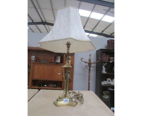 A table lamp with shade.