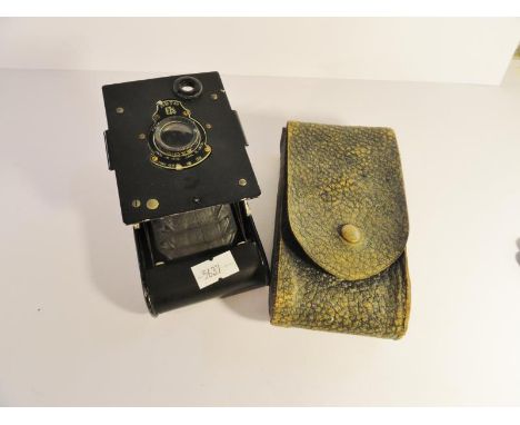 An early 20th century folding camera.