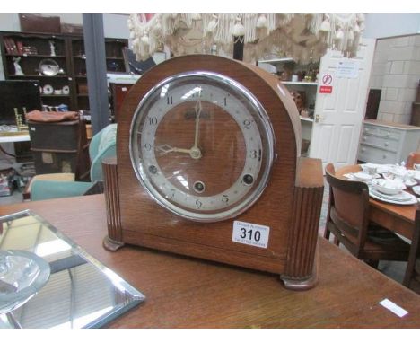 A Bentina wooden mantel clock.
