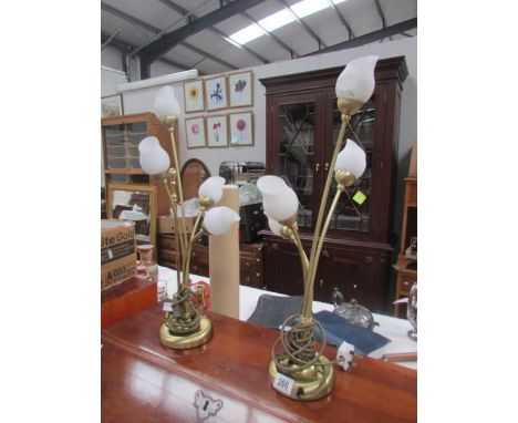 A pair of modern 3 light table lamps.