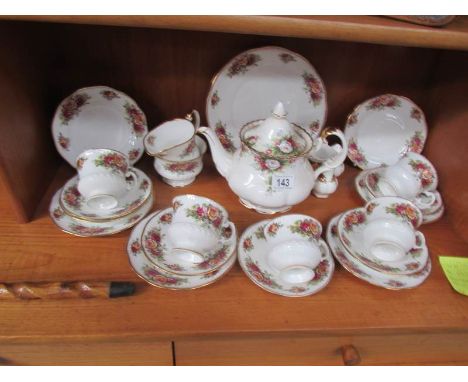 A Royal Albert celebration pattern teapot and a quantity of Elizabethan English Garden floral teaware.