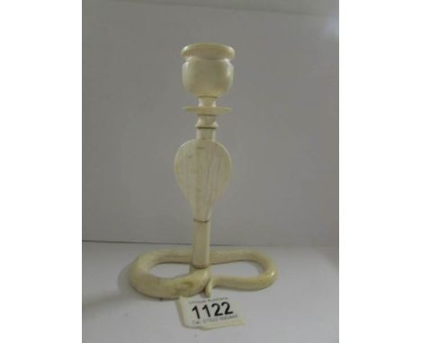 A 19th century ivory cobra candlestick.