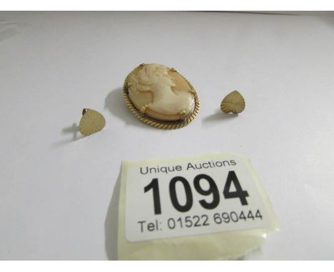 A Vintage cameo in yellow metal with safety chain and a pair of 9ct gold heart shaped earrings.