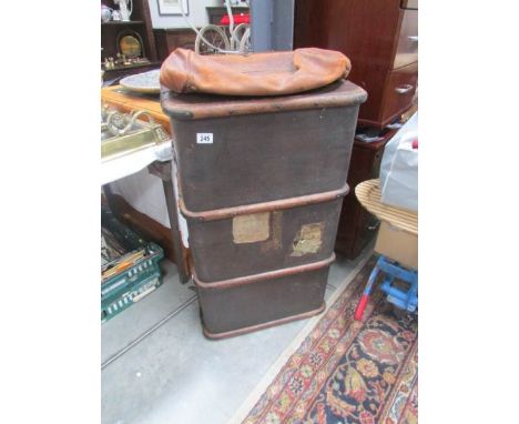 A cabin trunk and a leather bag.